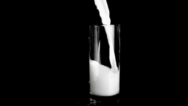 Milk in super slow motion being spilled — Stock Video