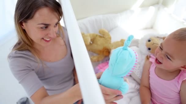 Woman playing dolls with her baby — Stock Video