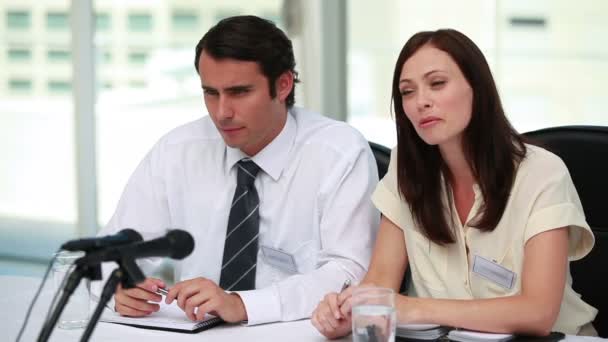 Man whispering to his colleague ear — Stock Video