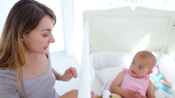 Baby girl kissing her teddy bear — Stock Video