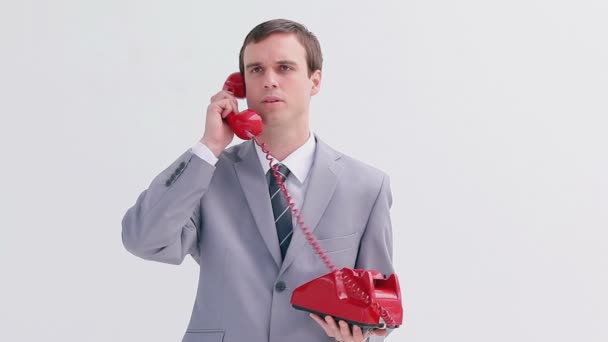 Angry businessman talking on the phone — Stock Video