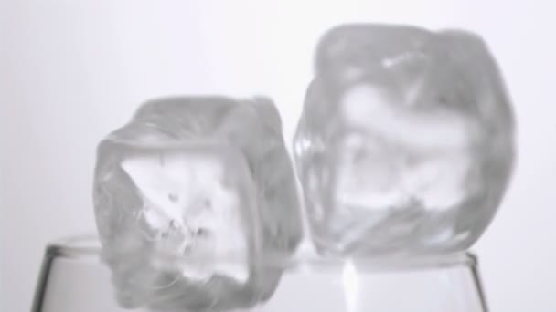 Ice cube falling in super slow motion — Stock Video