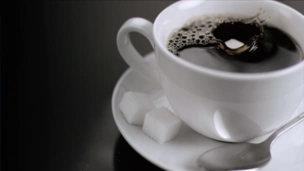 Cube of sugar falling in super slow motion — Stock Video