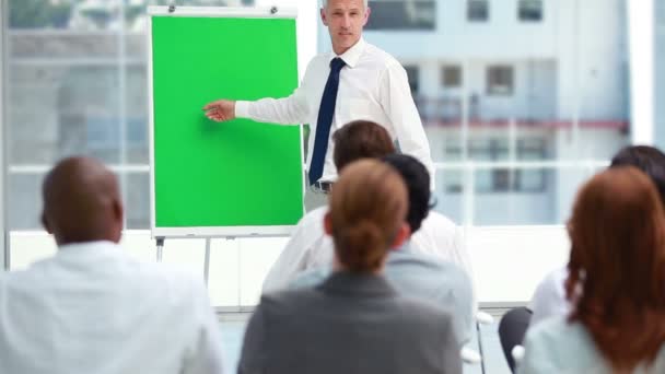 Man showing with the board with his hand — Stock Video