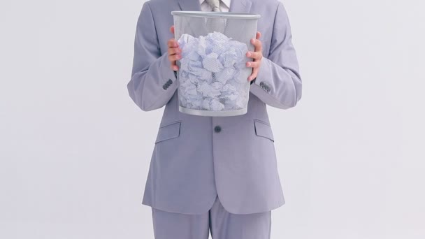 Serious businessman holding a bin Royalty Free Stock Footage