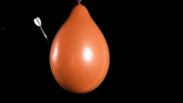 Orange balloon in super slow motion exploding — Stock Video