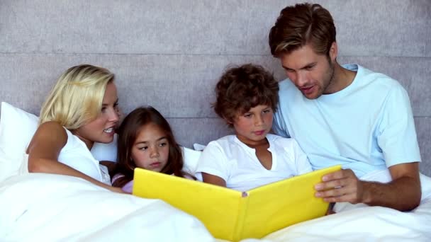 Parents reading story to children Video Clip