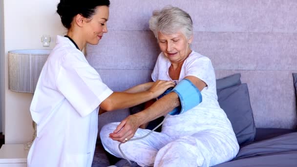 Nurse checking patients blood pressure Video Clip
