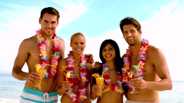 Friends wearing garlands and enjoying cocktails Stock Footage