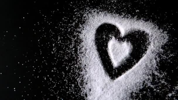 Hjärtdesign formad ut socker blåser bort — Stockvideo