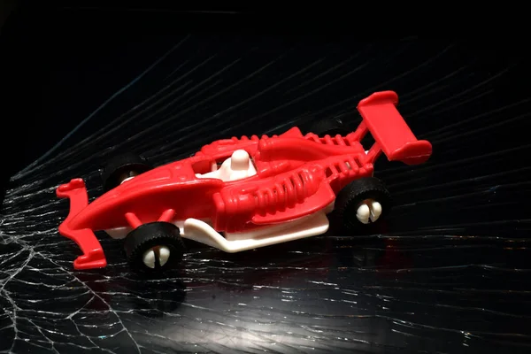 Picture Child Toy Racing Car Red Races Dark Road — Fotografia de Stock