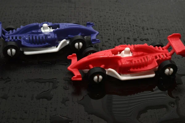 Children Toys Racing Cars Blue Red Dark Road —  Fotos de Stock