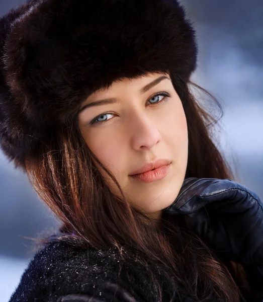 Young beaytiful women in fur hats in winter forest — Stock Photo, Image