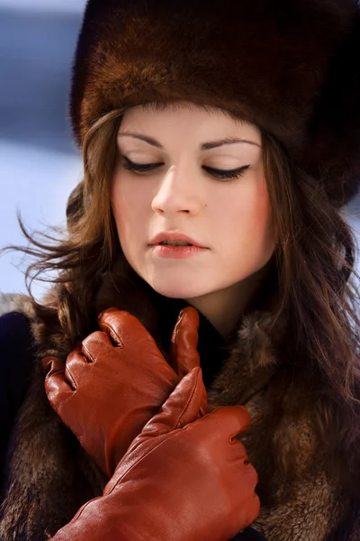 Young beaytiful women in fur hats in winter forest — Stock Photo, Image