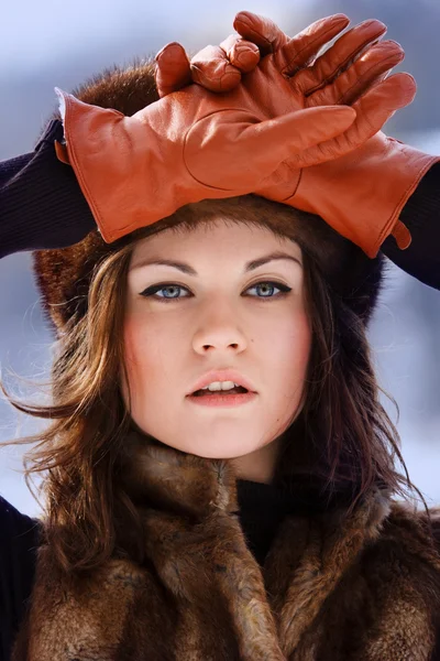 Young beaytiful women in fur hats in winter forest — Stock Photo, Image