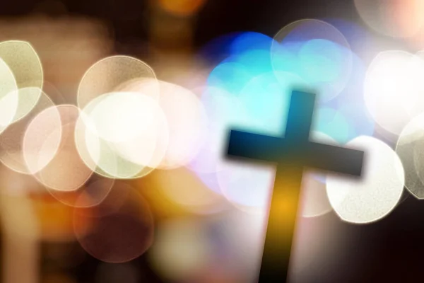 beautiful bokeh with cross in the background, concept for religi