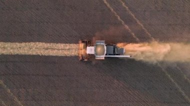 Harvesting of grain crops.Harvesting wheat,oats and barley in fields,ranches and farmlands.Combines mow wheat in the field.Agro-industry.Combine Harvester Cutting on wheat filed.Machine harvest wheat