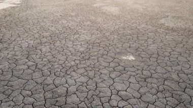 Geology.Dried-up riverbeds and lakes. Drought, global warming and climate change. Cracked dry earth and soil.Dry desert, drought season. Idea concept symbol disaster ecology in nature.