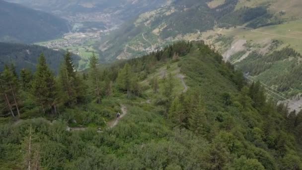 Mountain biker on trail in alps aerial flight - 4k UHD — Stock Video