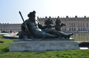 Statue in the gardens of Versailles Palace, Paris (France)