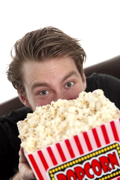Man looking up from the popcorn — Stock Photo, Image