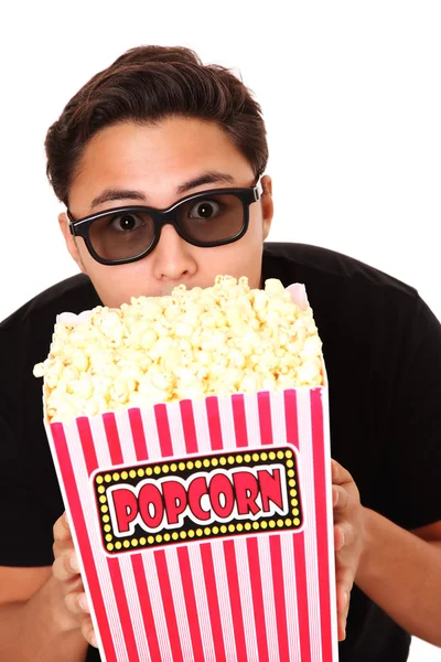 Man hiding behind a popcorn bucket — Stock Photo, Image