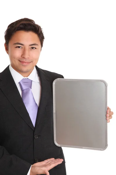 Businessman with a chrome sign showing — Stock Photo, Image