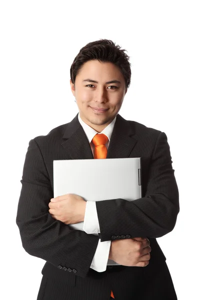 Joven hombre de negocios con portátil — Foto de Stock