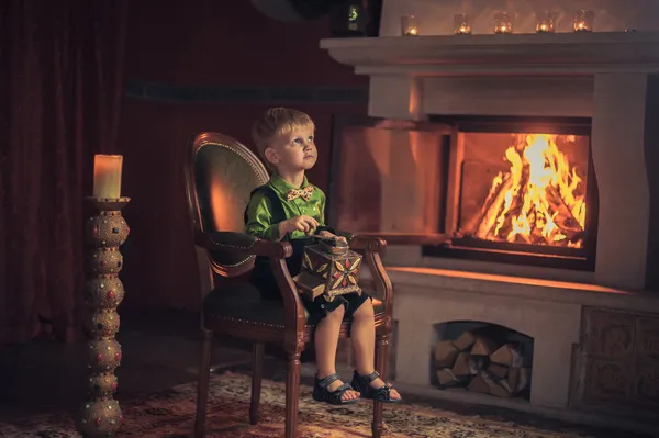 Children by the fireplace — Stock Photo, Image