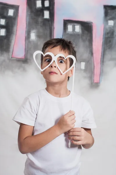 Boy with artificial things on the stick — Stock Photo, Image