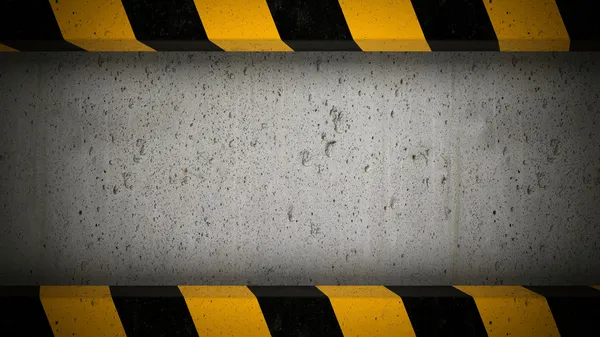 pantalla de hormigón con marco de rayas de precaución