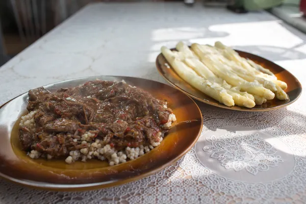 Beef goulash, pearl barley and asparagus with mayonnaise. — Stock Photo, Image