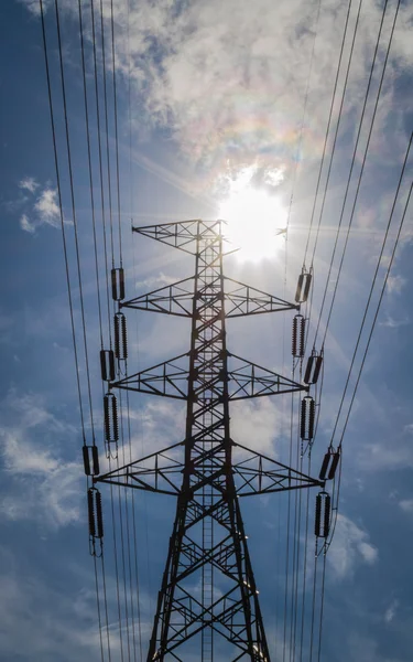 Silhouette of high voltage tower with blue sky — Stock Photo, Image