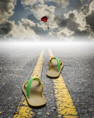 a pair of sandal on the road with parachute on the sky clipart