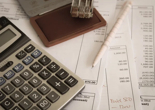 Office document with rubber stamp, pen and calculator — Stock Photo, Image