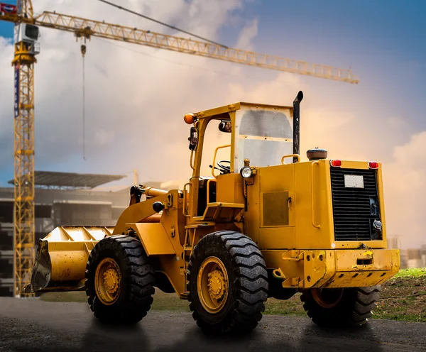 Yellow tractor on the road — Stock Photo, Image