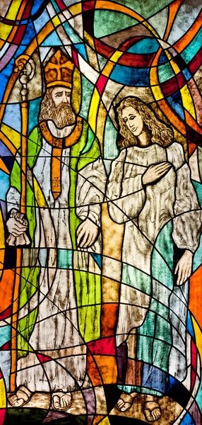 Stained glass showing Bishop Nicholas and believer — Stock Photo, Image