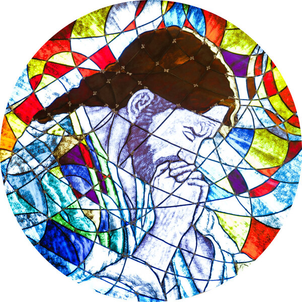 Stained glass showing Jesus praying