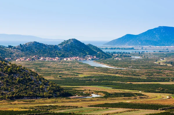 Neretva valley with hills and sea in background — Stock Photo, Image