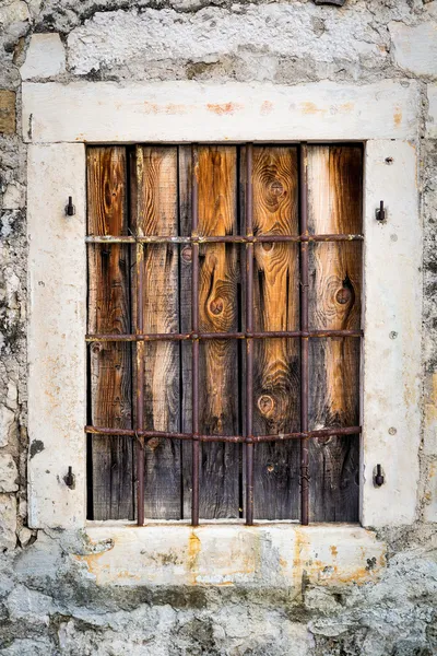 Rusty metal window with bars — Stock Photo, Image