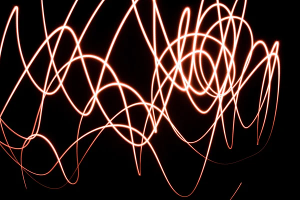 Linhas de luz abstratas durante a noite — Fotografia de Stock