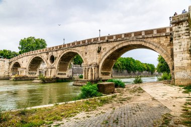 view of bridge over tiber river in rome,italy