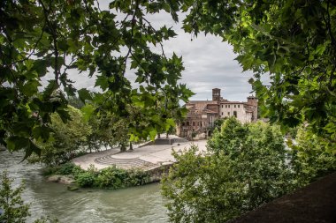 View on Isola Tiberina or the Tiber river Island and Fatebenefratelli Hospital. clipart