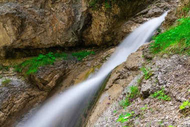With its weathered crags and pinnacles, Rosengartenschlucht Canyon in Imst, Oberinntal Valley, is one of Austrias most spectacular natural sights. Rosengarten, literally Rose Garden, is a narrow chasm, incised into the rock by the cascading waters