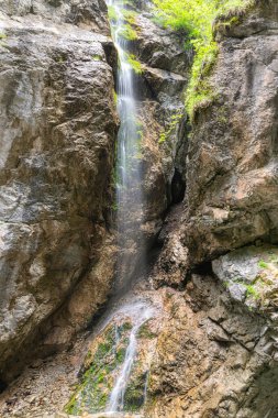 With its weathered crags and pinnacles, Rosengartenschlucht Canyon in Imst, Oberinntal Valley, is one of Austrias most spectacular natural sights. Rosengarten, literally Rose Garden, is a narrow chasm, incised into the rock by the cascading waters 