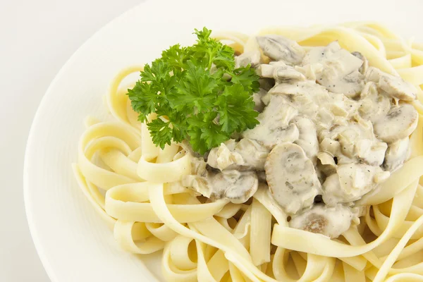 Pasta with mushrooms and sauce — Stock Photo, Image