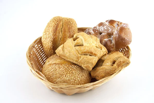 Bread and pastries on a basket — Stock Photo, Image