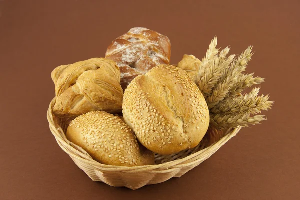 Bread and pastries on a basket — Stock Photo, Image