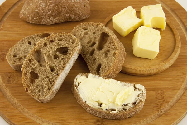 Composición con pan y mantequilla — Foto de Stock