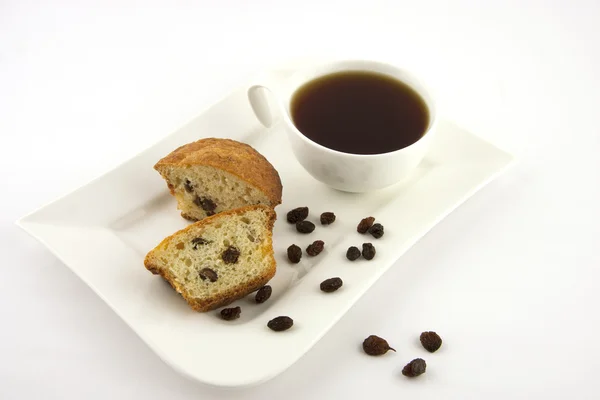Muffins with raisins and tea cup — Stock Photo, Image